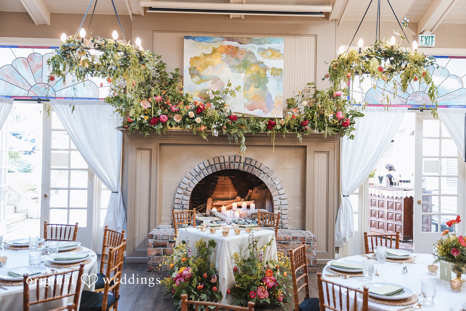 Benjamin + Amber Wedding setup of tables decorated with flowers