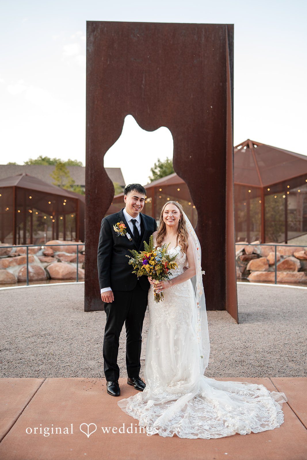 Brekyn + Benjie The couple in the outdoors of the wedding venue