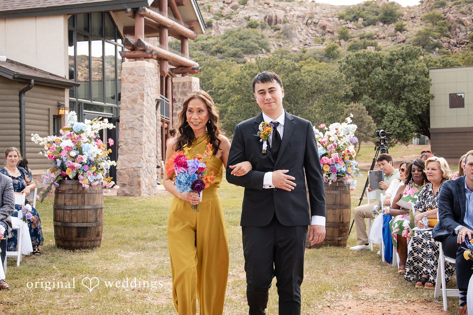 Brekyn + Benjie The bridal party walks down the aisle