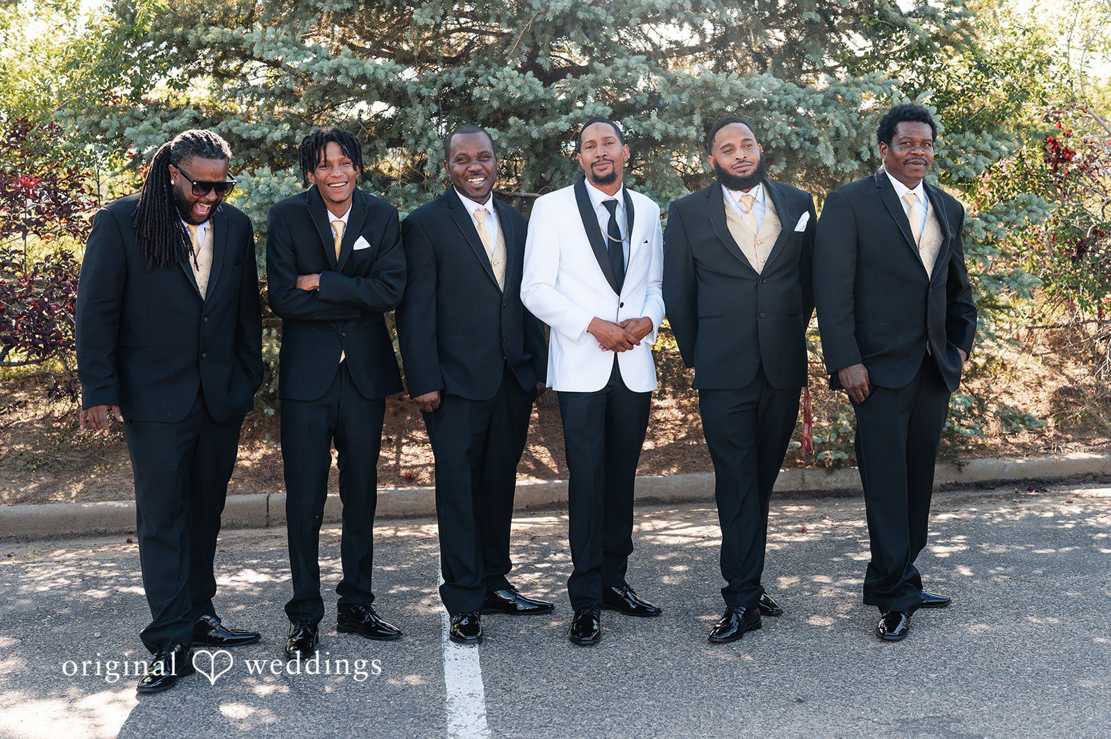 Groom and groomsmen standing together at Radiance Event Center.