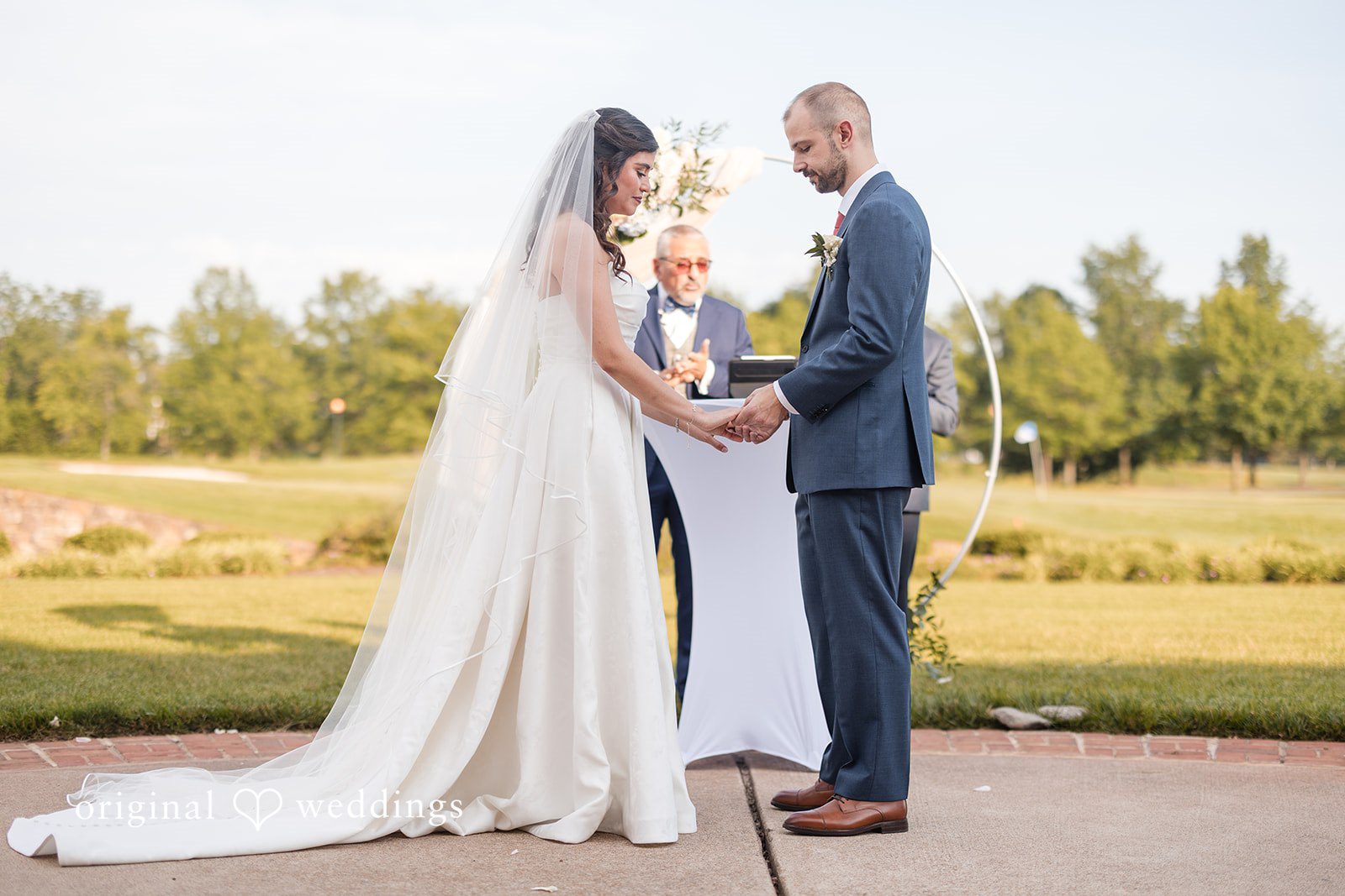 The bride and groom exchange marital vows