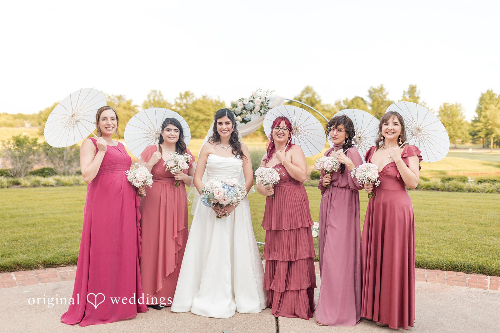 A stunning portrait of the bride and her bridesmaids at the wedding venue