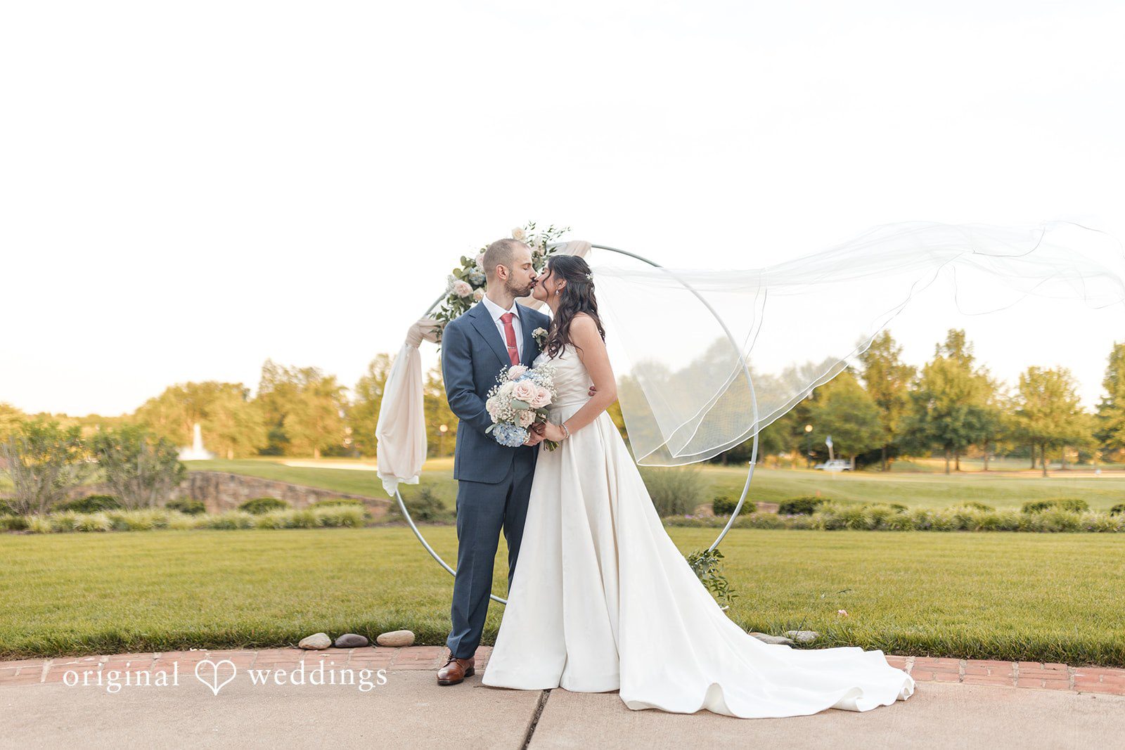 The couple shares a romantic kiss