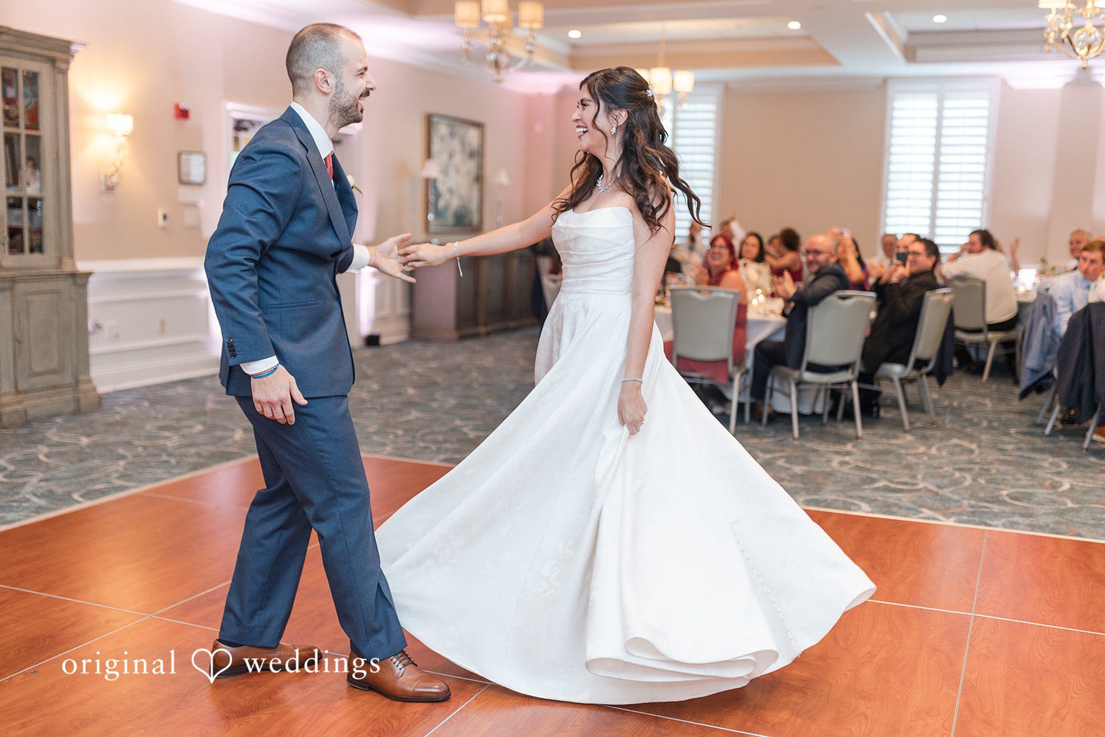 The couple takes their first dance