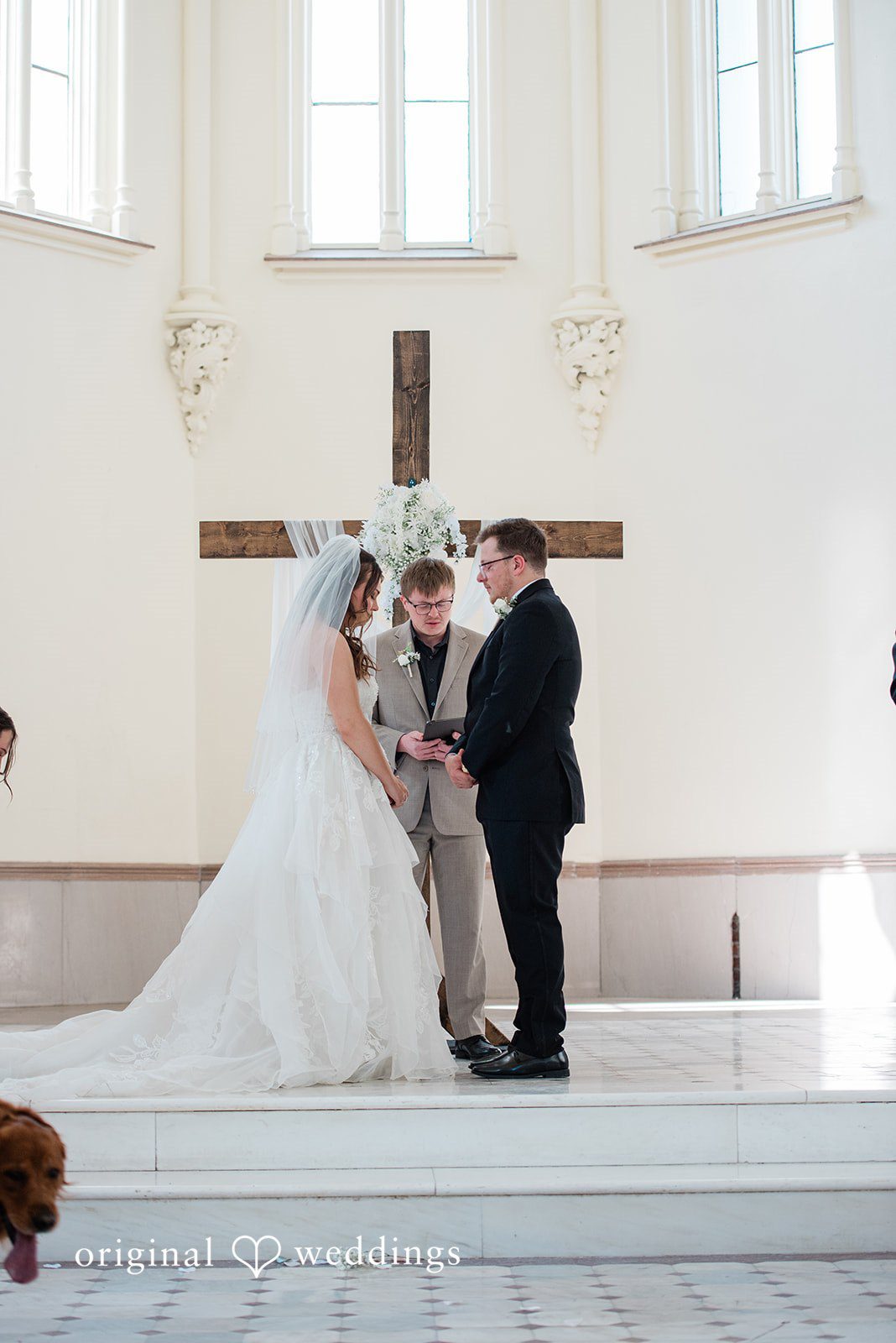 Bride and groom listening to vows during the ceremony