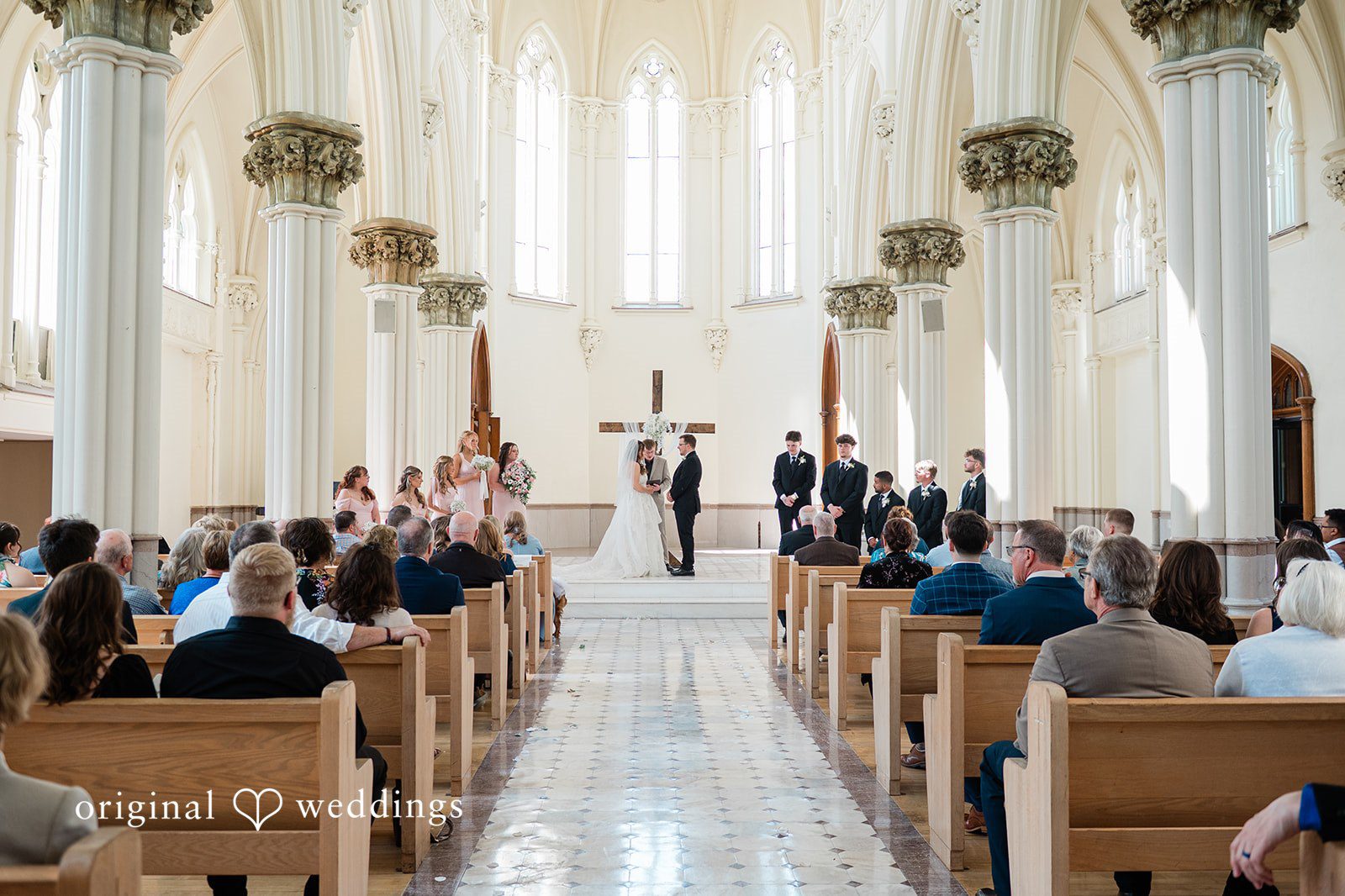 Wide view of the ceremony with the couple and wedding guests