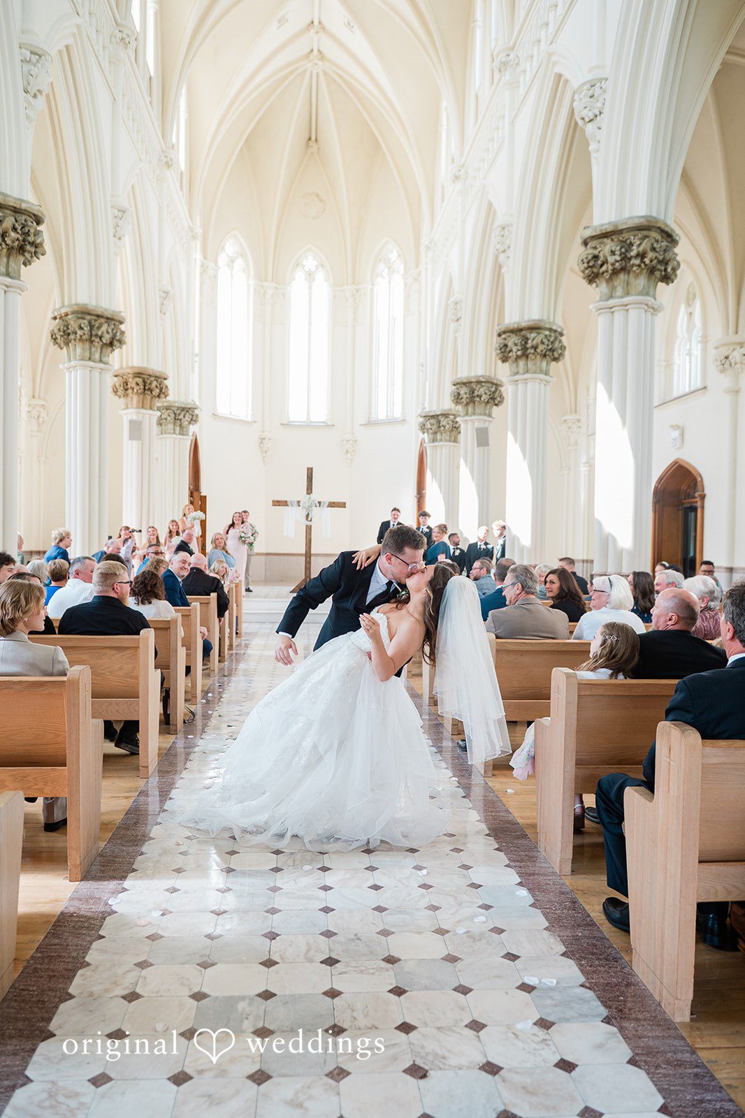 Bride and groom kissing in the center of the ceremony space