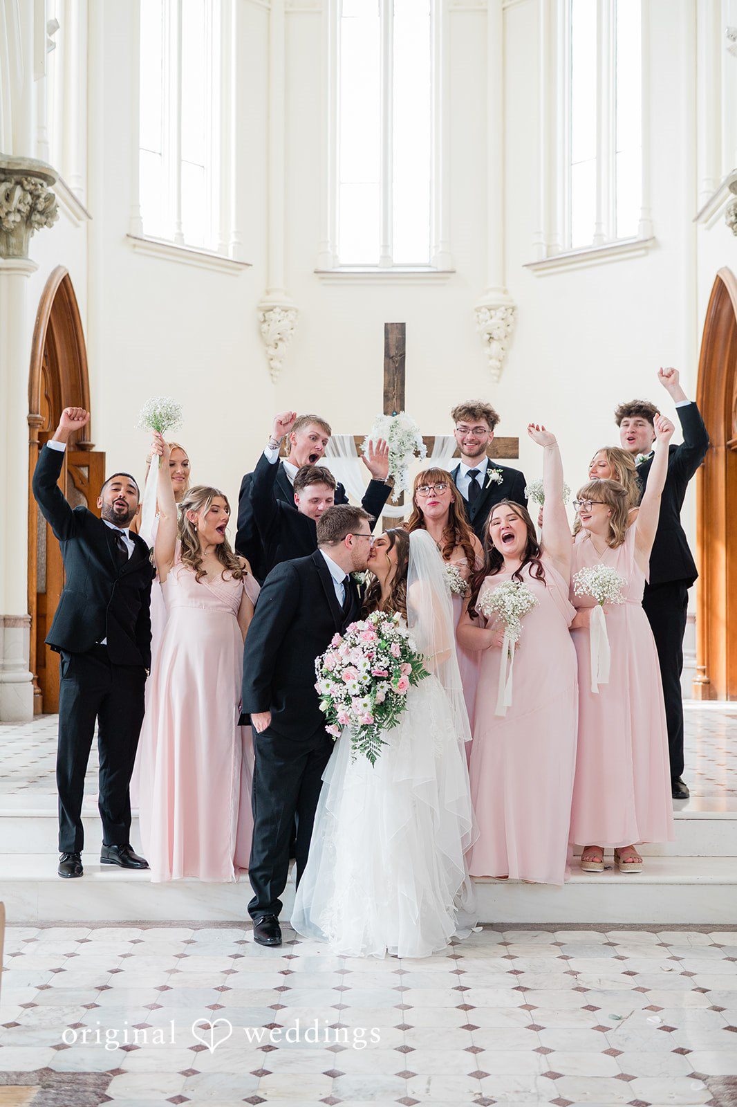 Bride and groom with bridesmaids and groomsmen in a group portrait