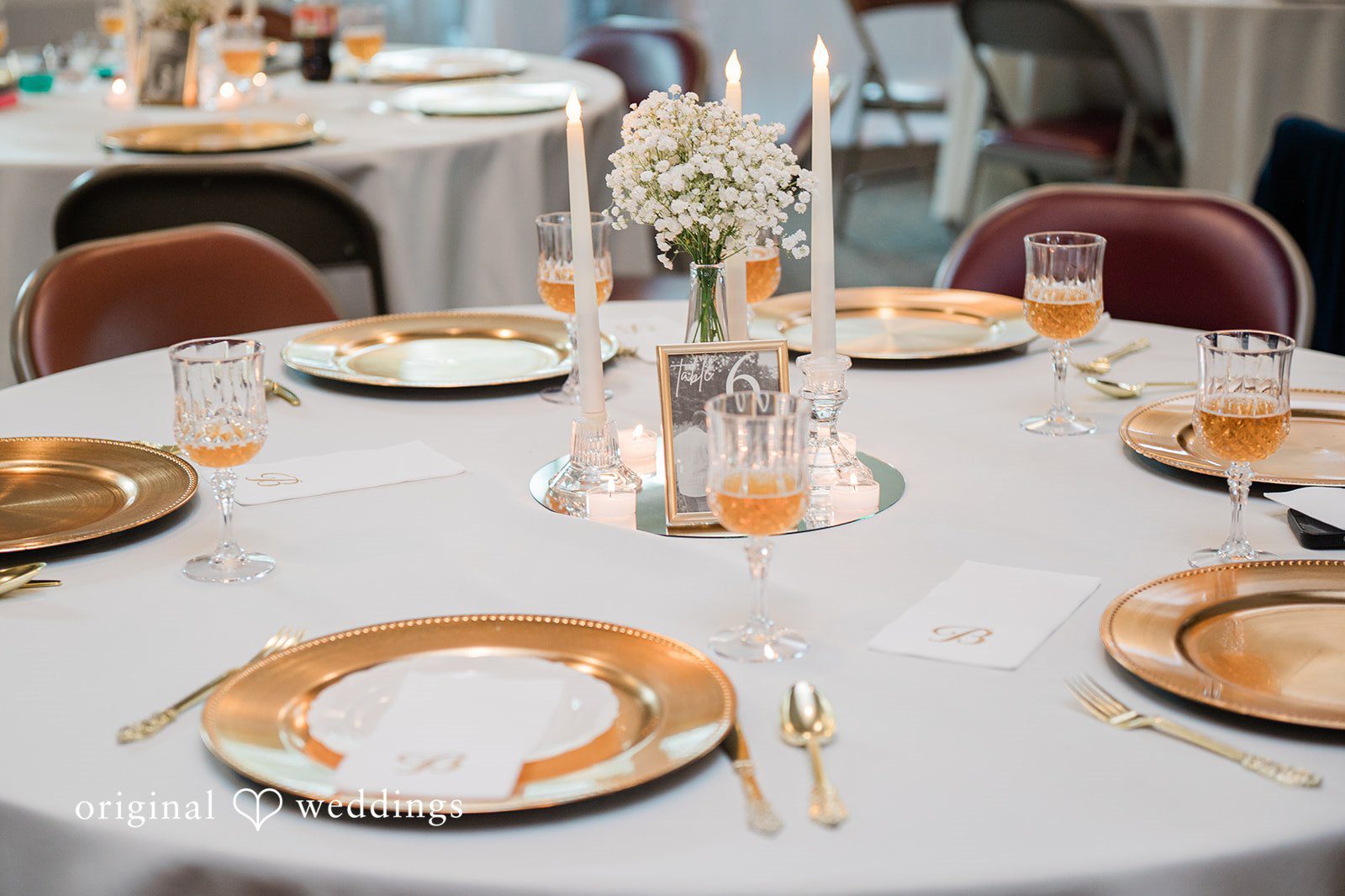 Decorated reception tables prepared for the wedding guests