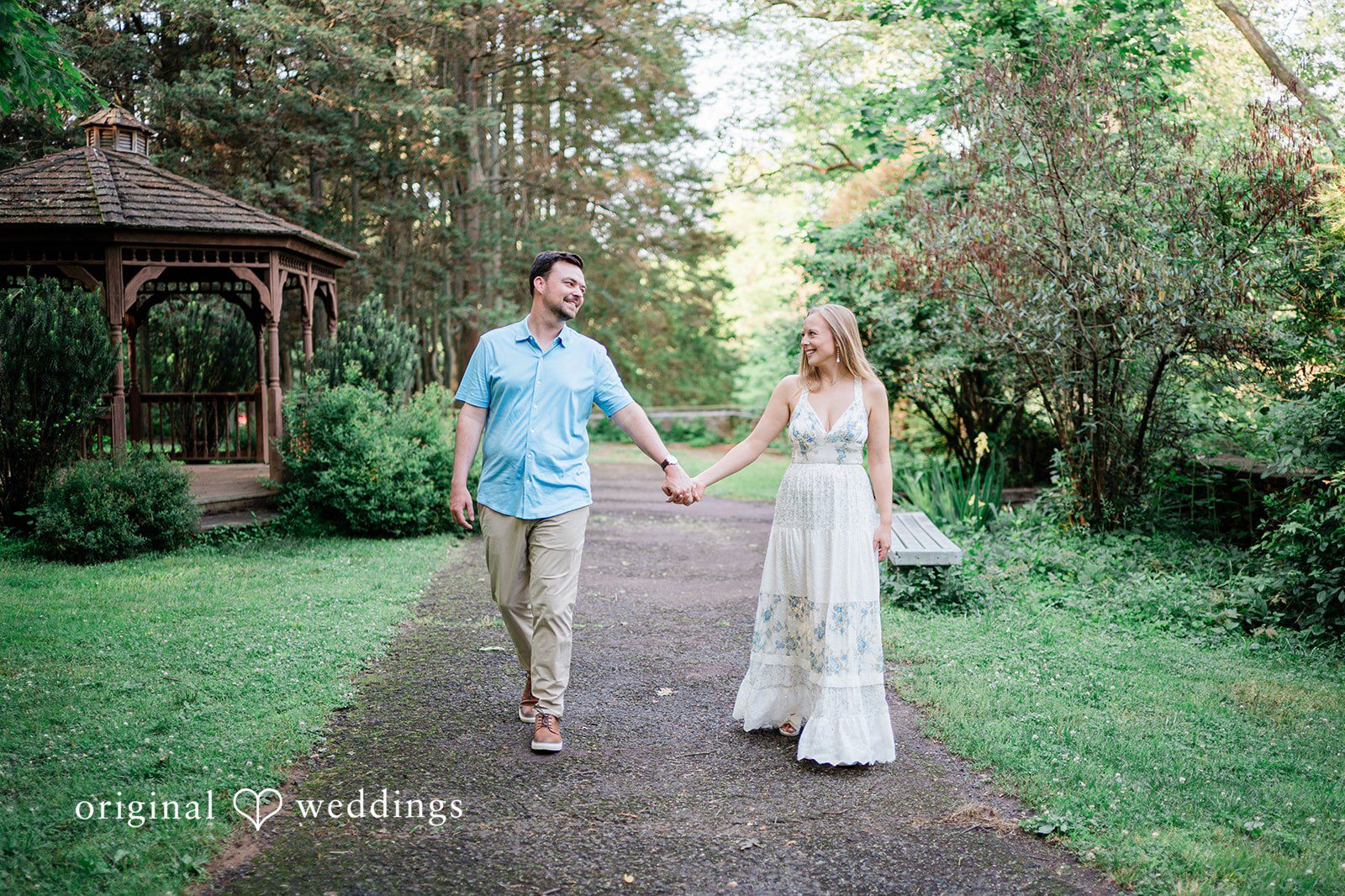 Justine + Danny Our Philadelphia engagement photographers at Original Weddings captured the couple taking a walk at Ridley Creek State Park