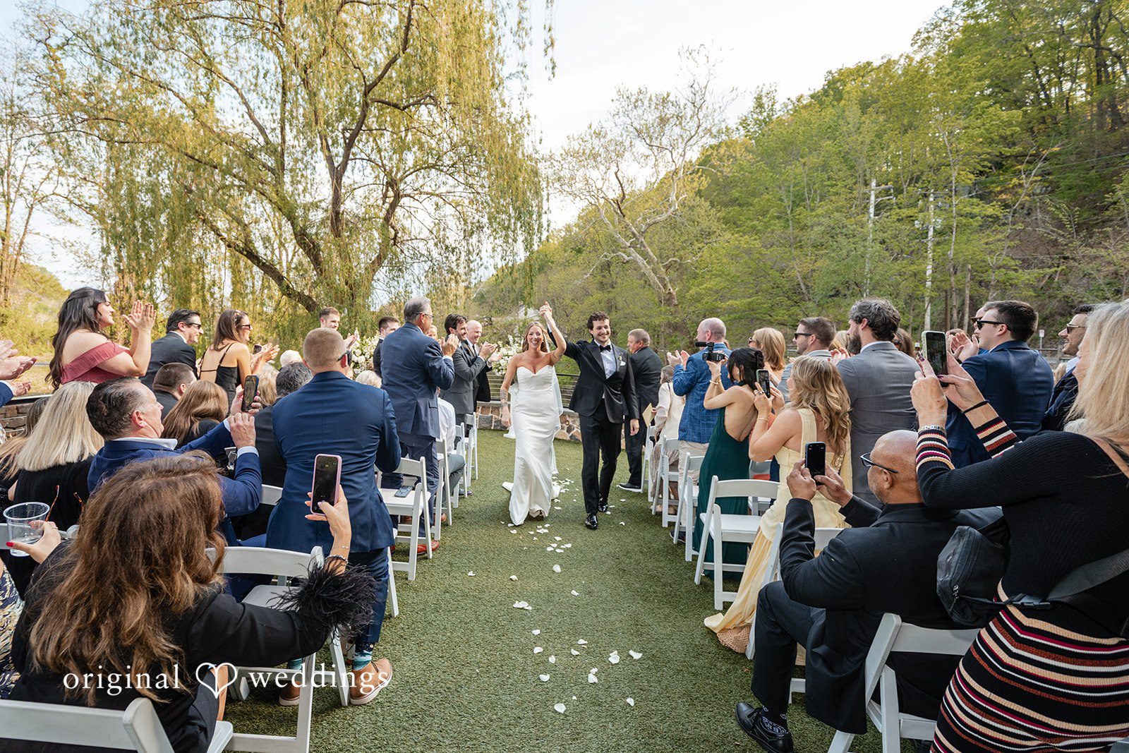 Couple walking hand in hand after the ceremony