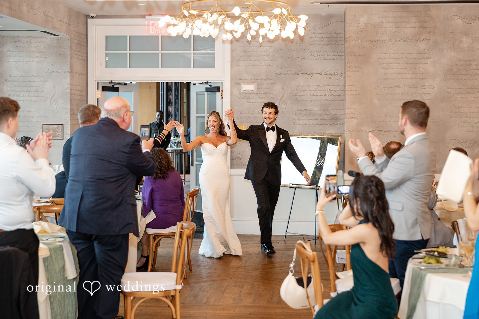 Bride and groom making their reception entrance together
