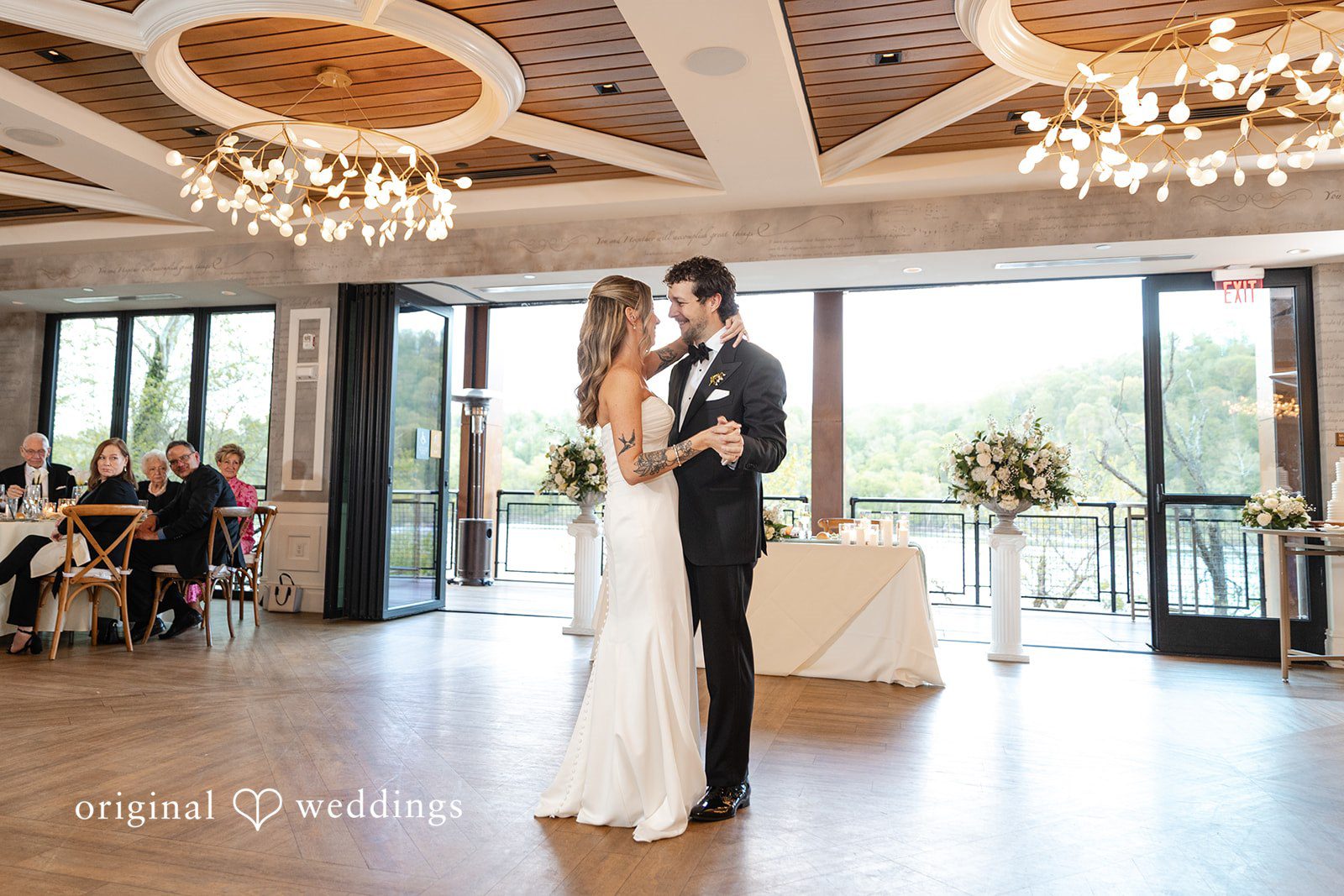 Bride and groom sharing their first dance at the reception
