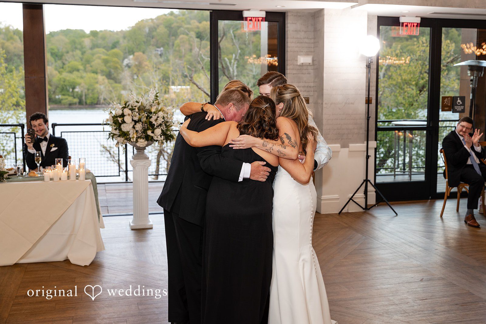 Bride celebrating on the dance floor with family members