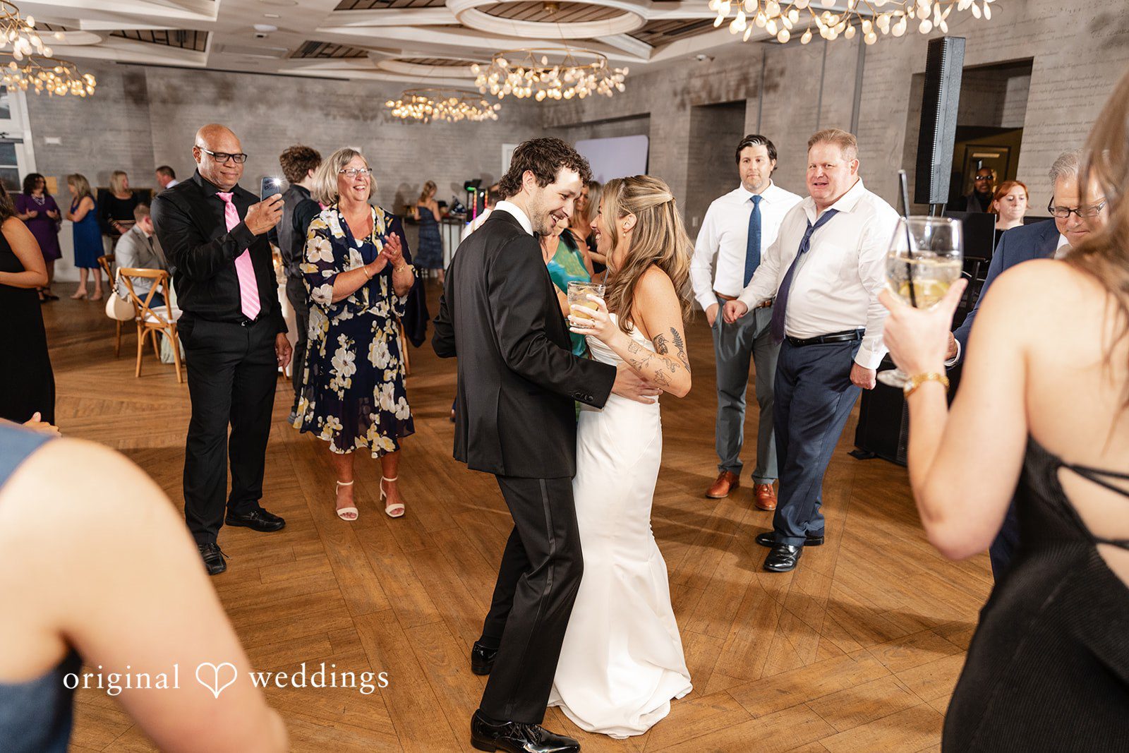 Bride and groom sharing joyful moments on the dance floor