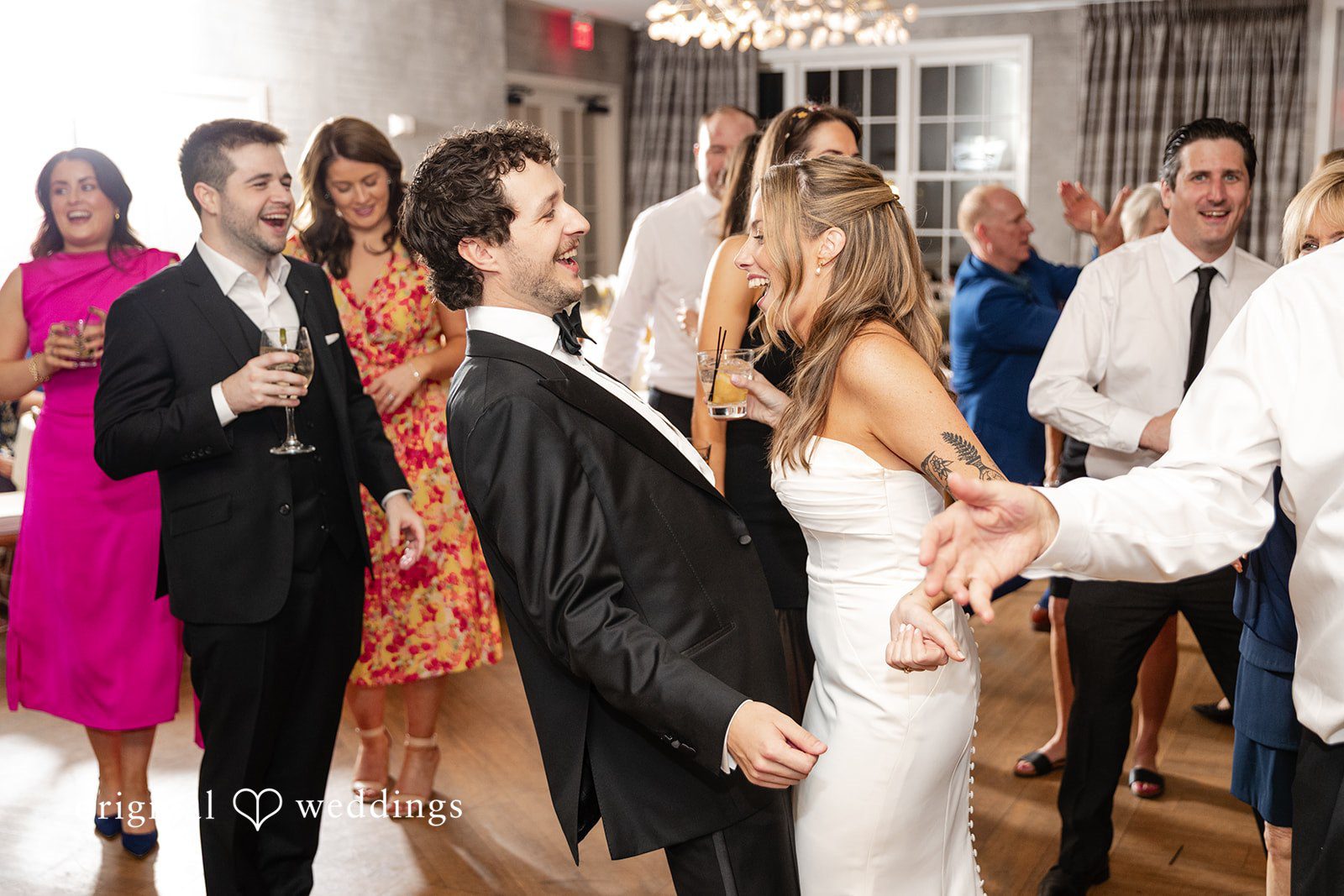Bride and groom playing games with guests during the reception celebration