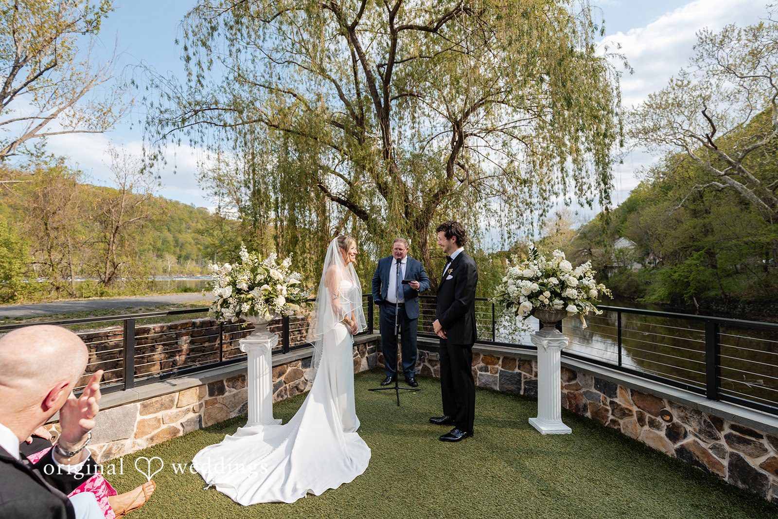 Bride and groom listening during the wedding ceremony vows