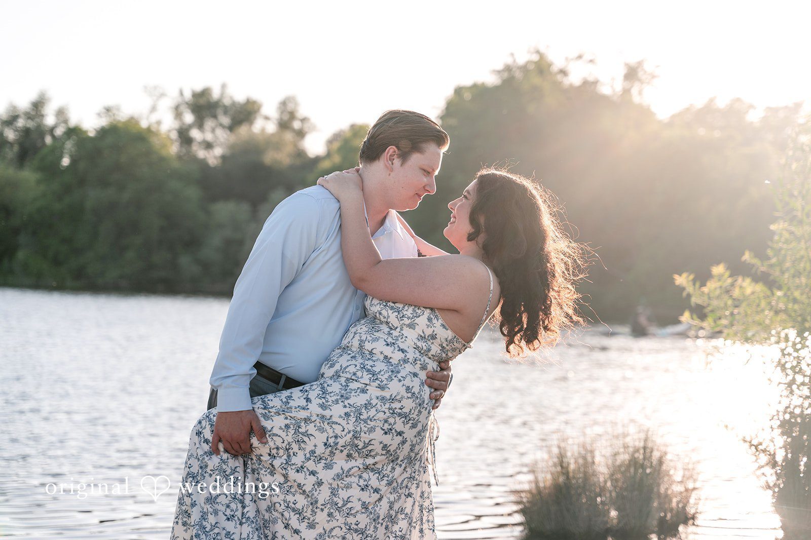 Our Sacramento engagement photographers at Original Weddings captured a romantic portrait of the couple by the waterfront at Sailor Bar County Park
