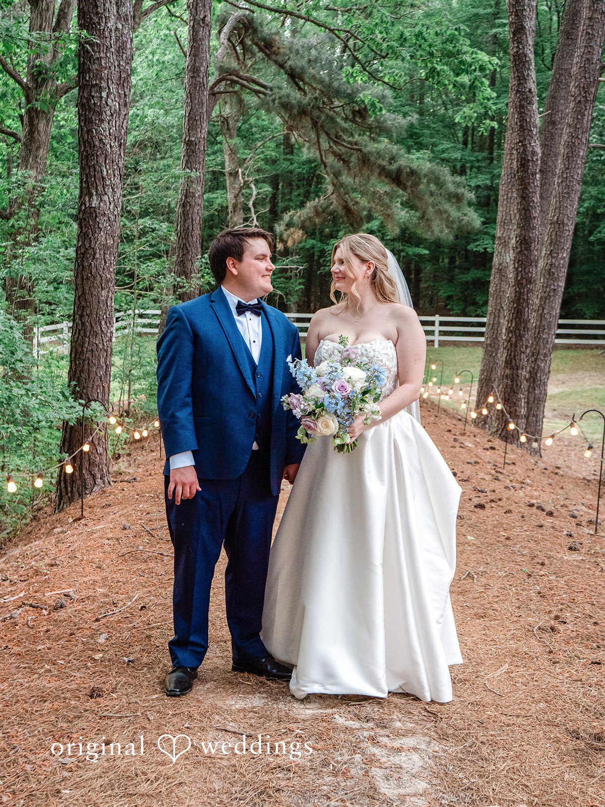 A romantic portrait of the couple by the garden paths
