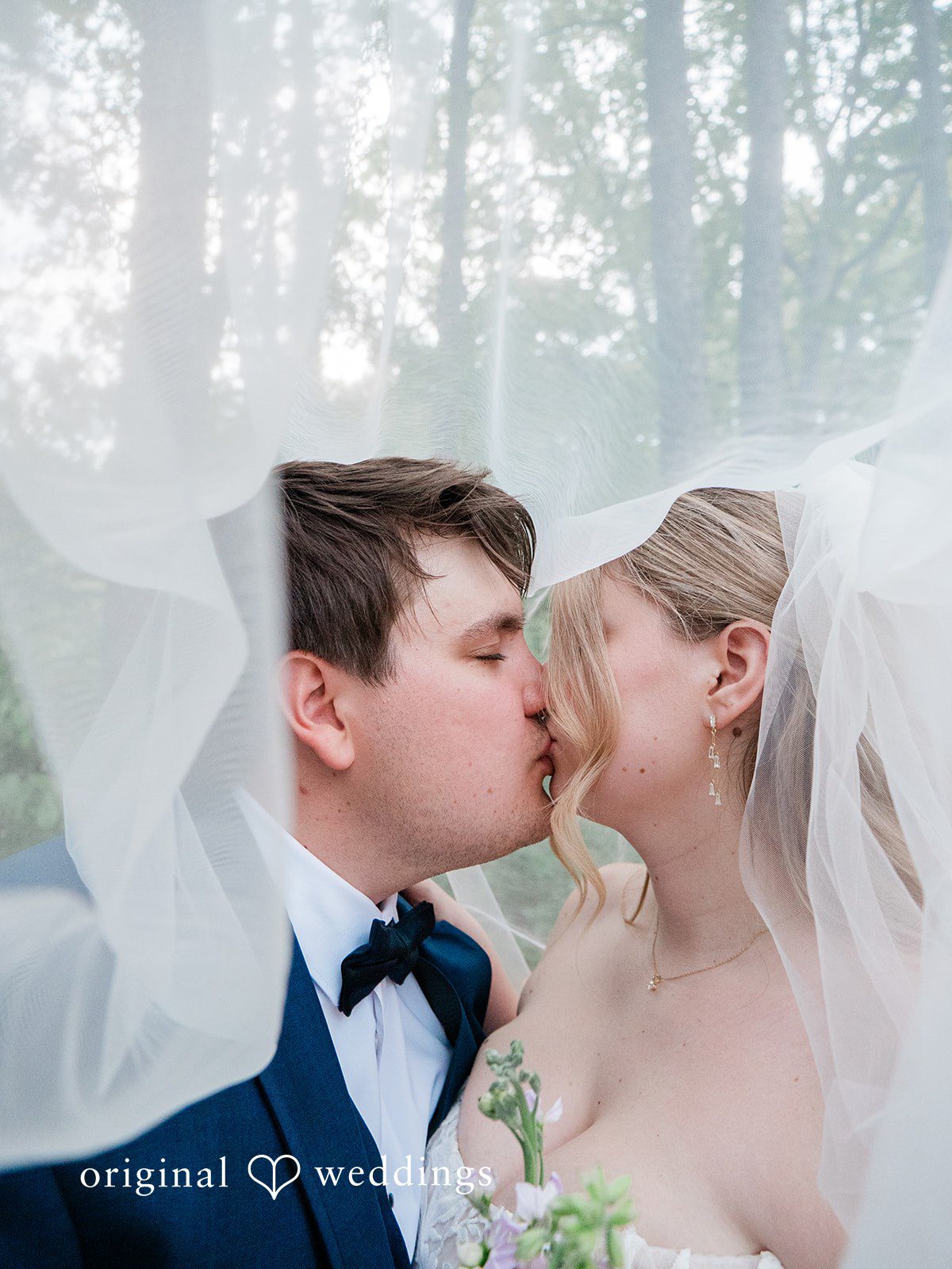 The couple shares a romantic kiss
