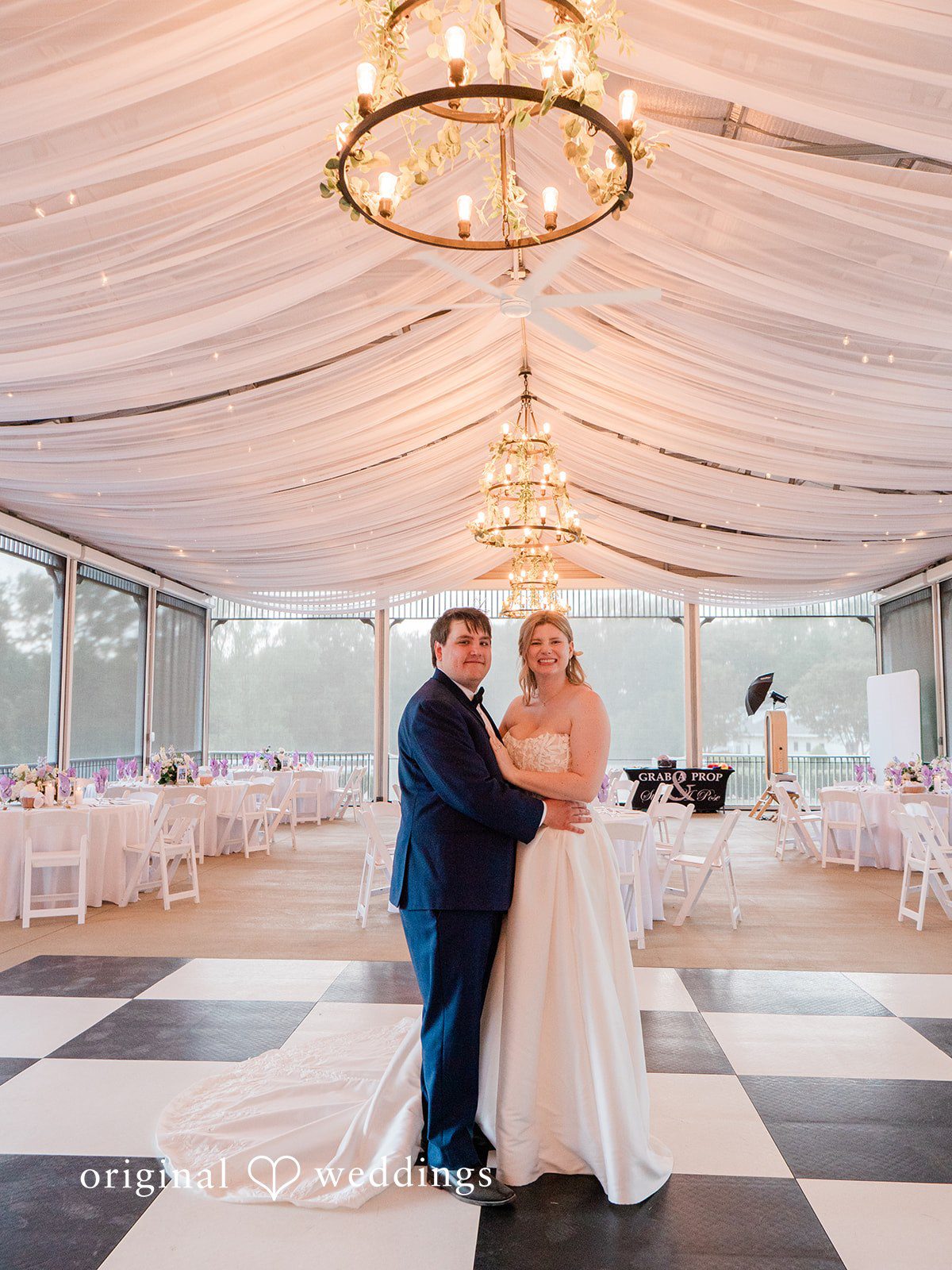 A gorgeous portrait of the couple in the wedding reception hall