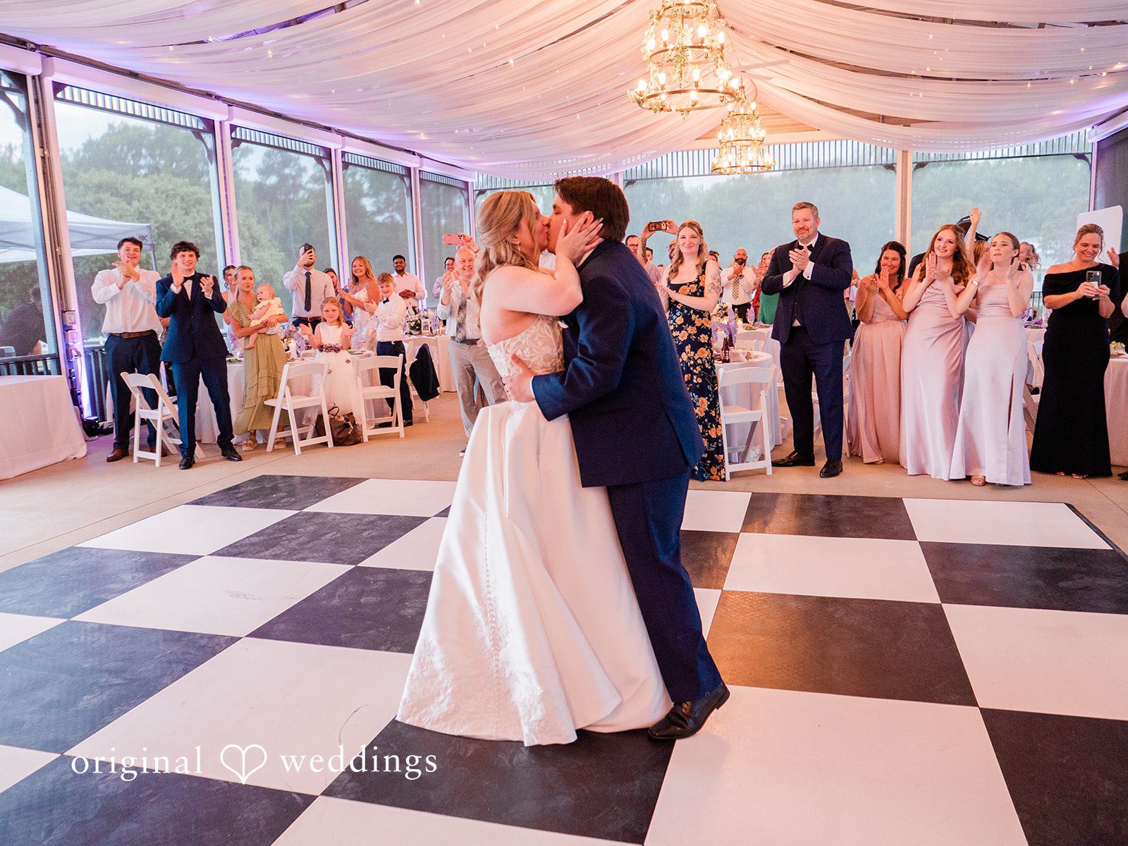 The couple kisses