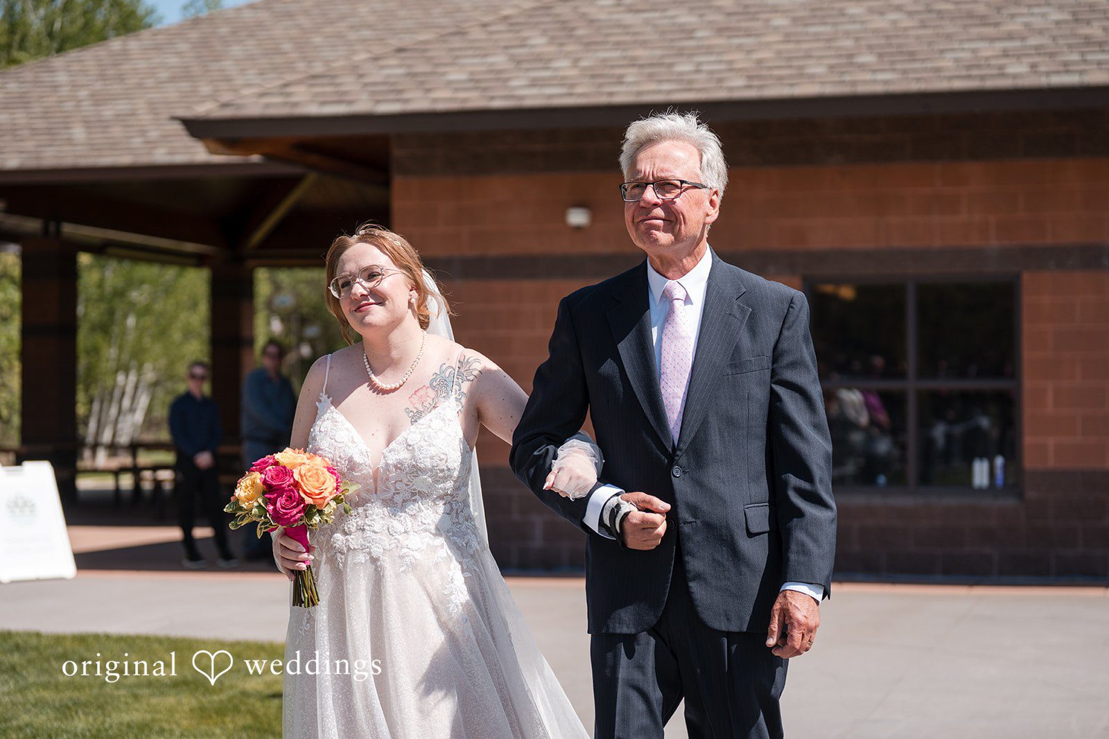 Katherine + Benjamin Our Minneapolis wedding photographers captured the moment the bride's father walked the bride down the aisle