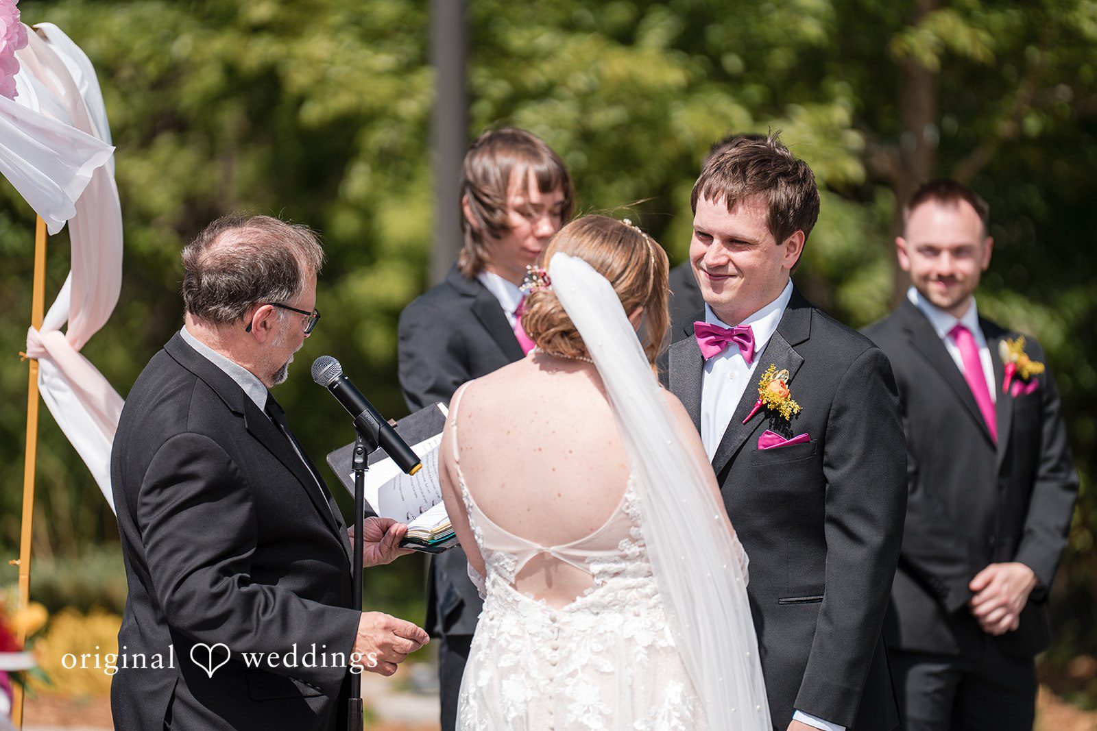 Katherine + Benjamin The priest presides over the union