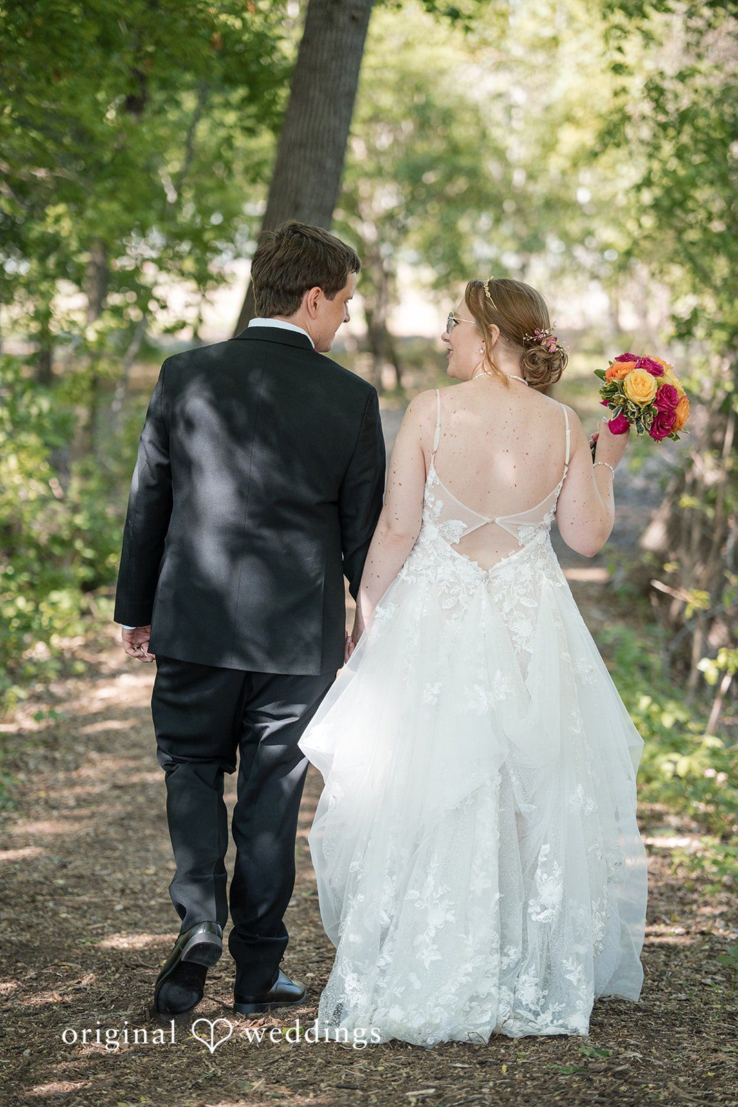Katherine + Benjamin The couple takes a walk through the garden paths