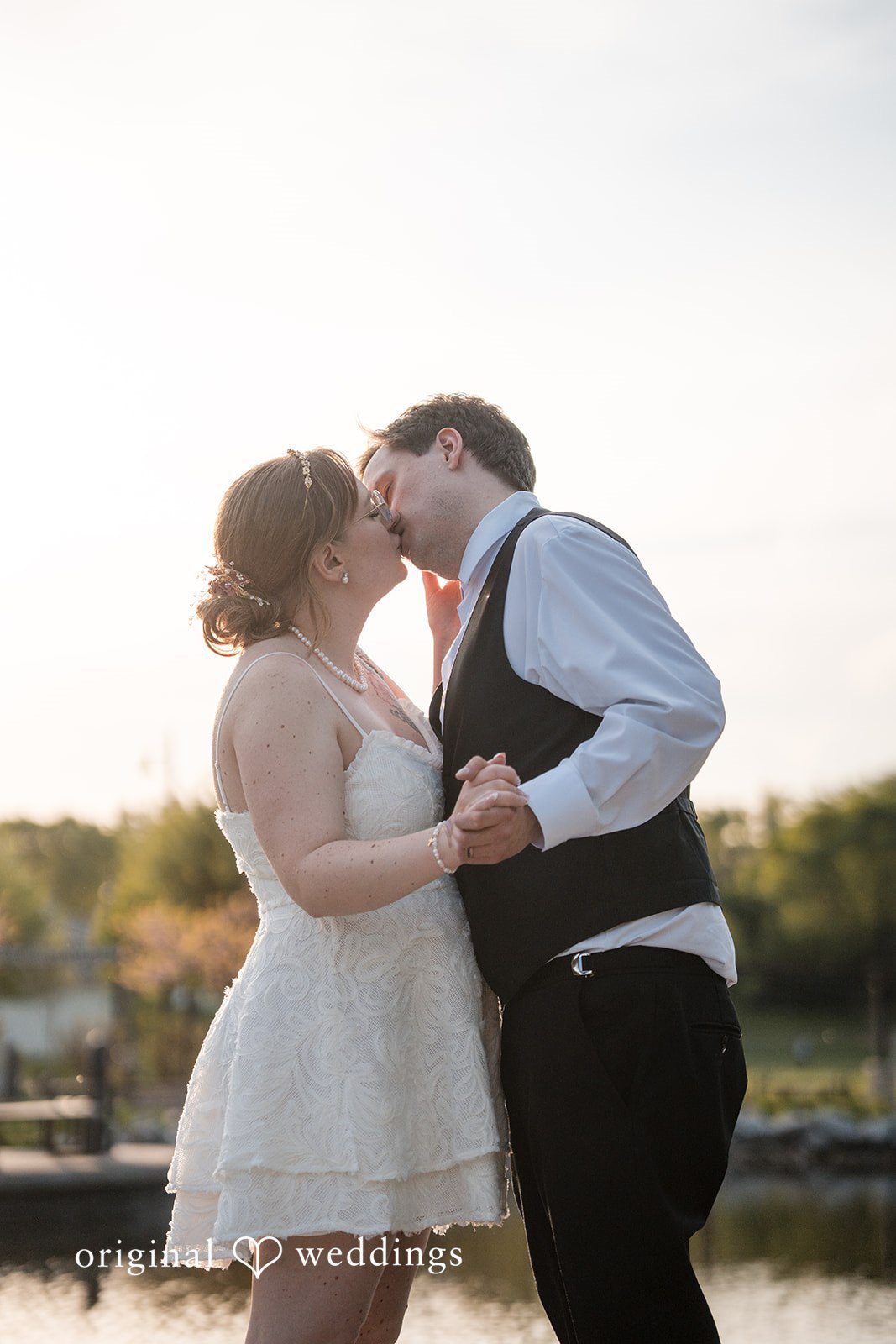 Katherine + Benjamin Our Minneapolis wedding photographers captured the moment the couple had a romantic kiss outdoors