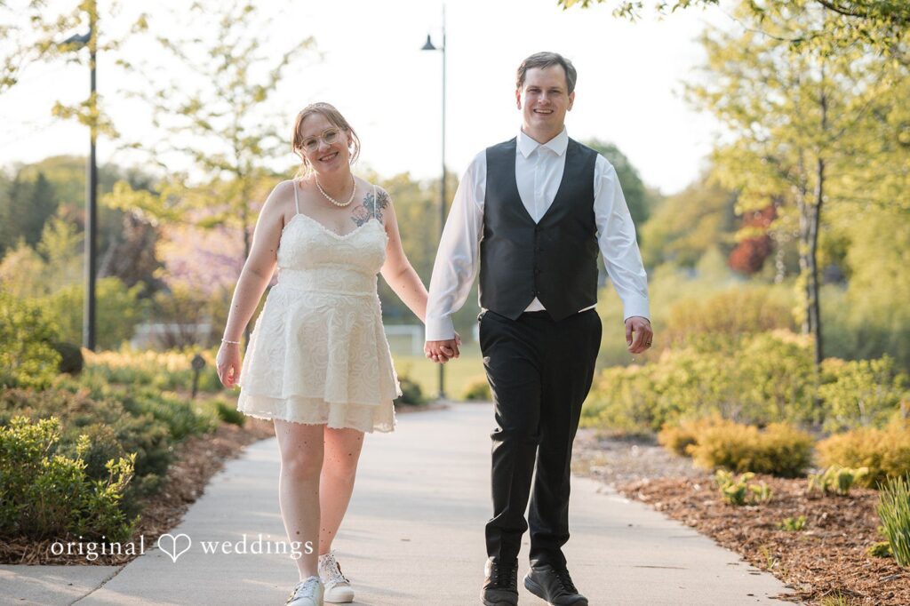 Katherine + Benjamin Our Minneapolis wedding photographers captured the moment the couple took a walk throughout the Shoreview Community Center