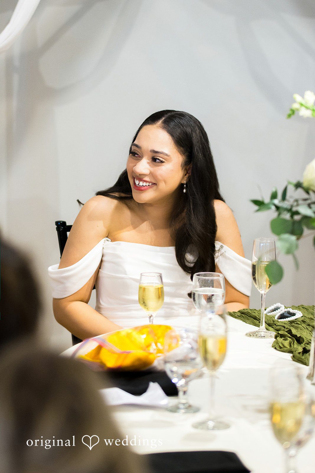 Kiarra + Anthony Beautiful seated bridal portrait while smiling at Solar Arts