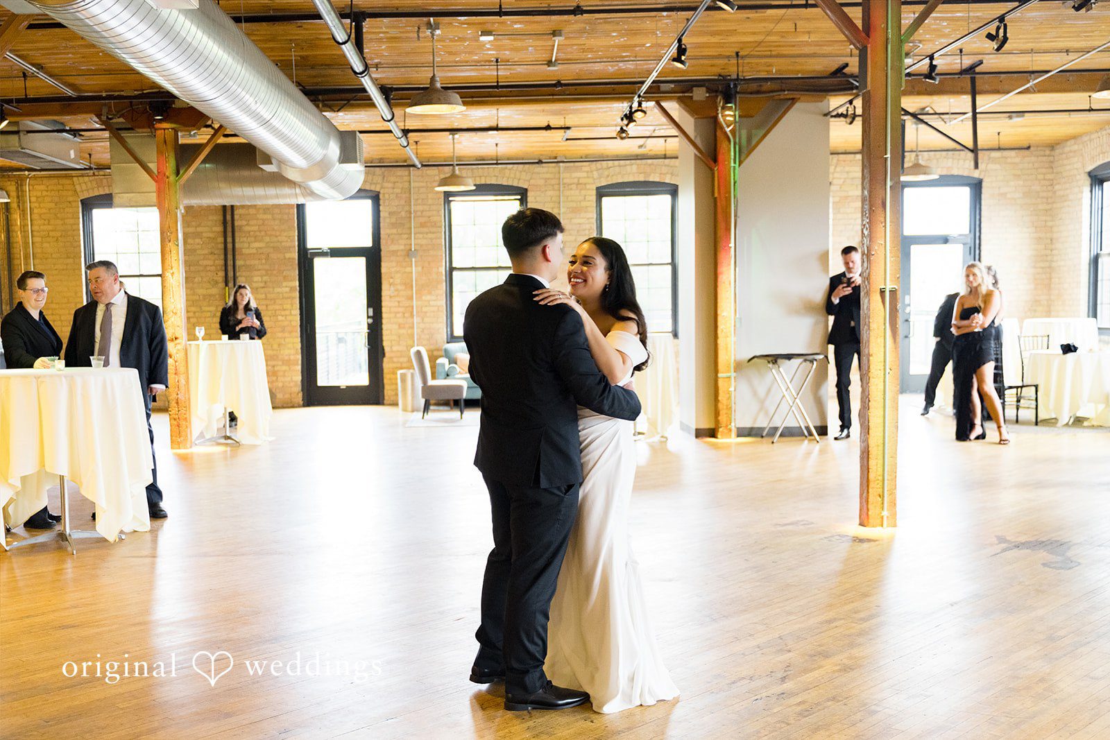Kiarra + Anthony Minneapolis Wedding Photographers capturing the couple dancing while looking at each other at Solar Arts by Original Weddings