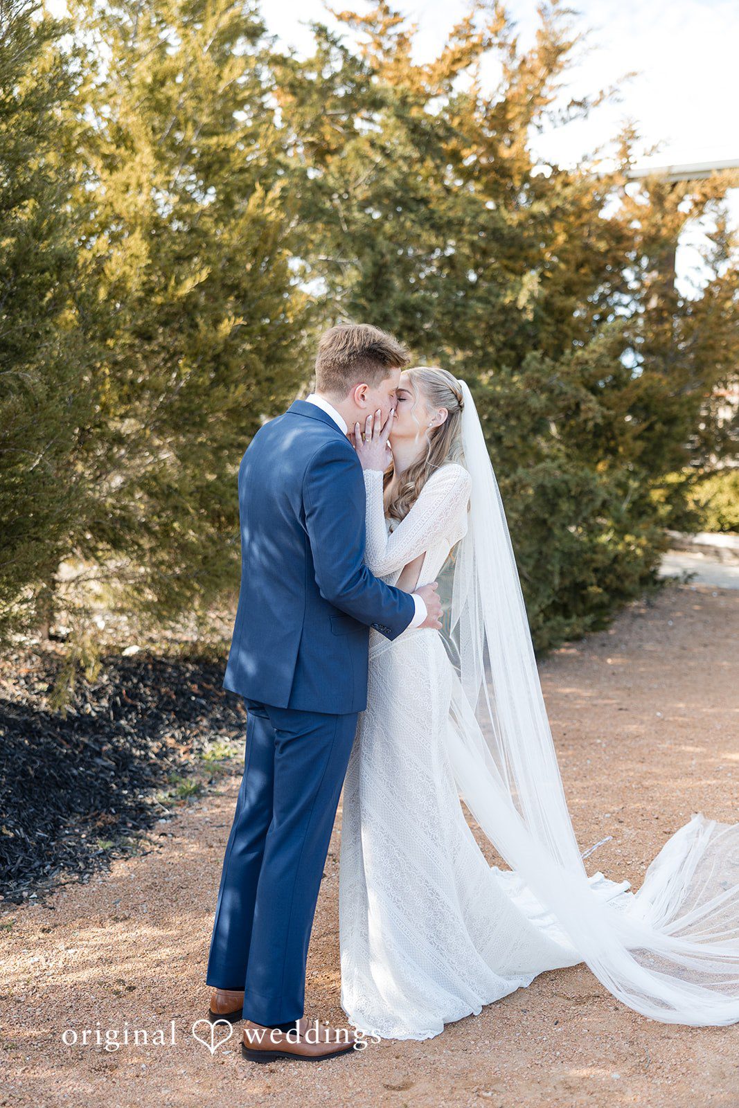 Jacobi + Marlie Romantic bride and groom kiss portrait at Stone Crest
