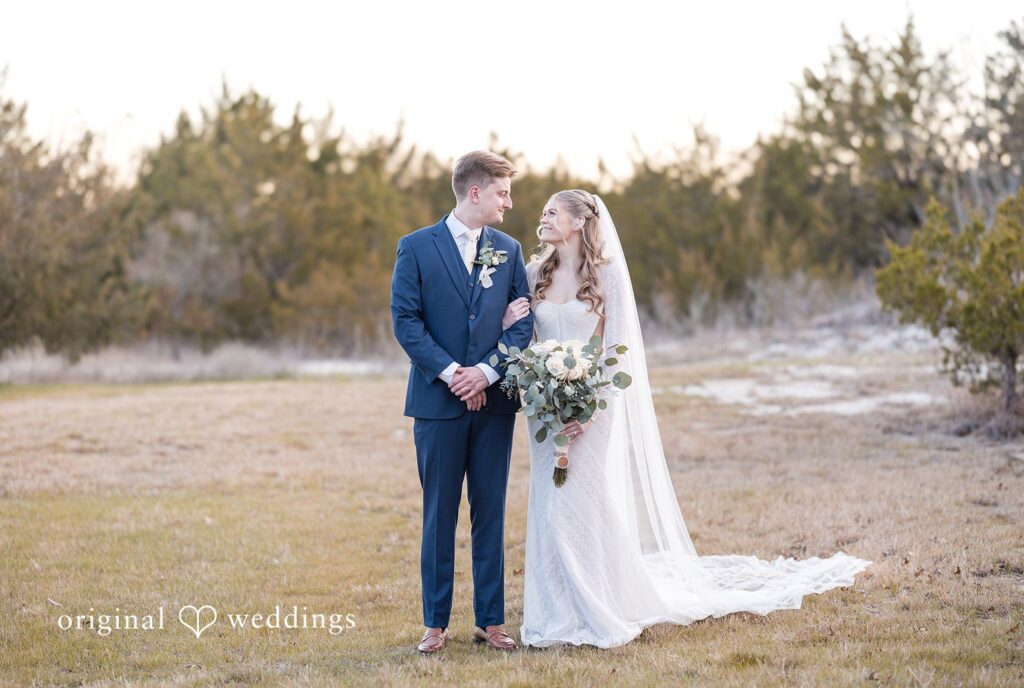 Jacobi + Marlie Dallas Wedding Photographers capturing couple looking at each other while smiling at Stone Crest by Original Weddings