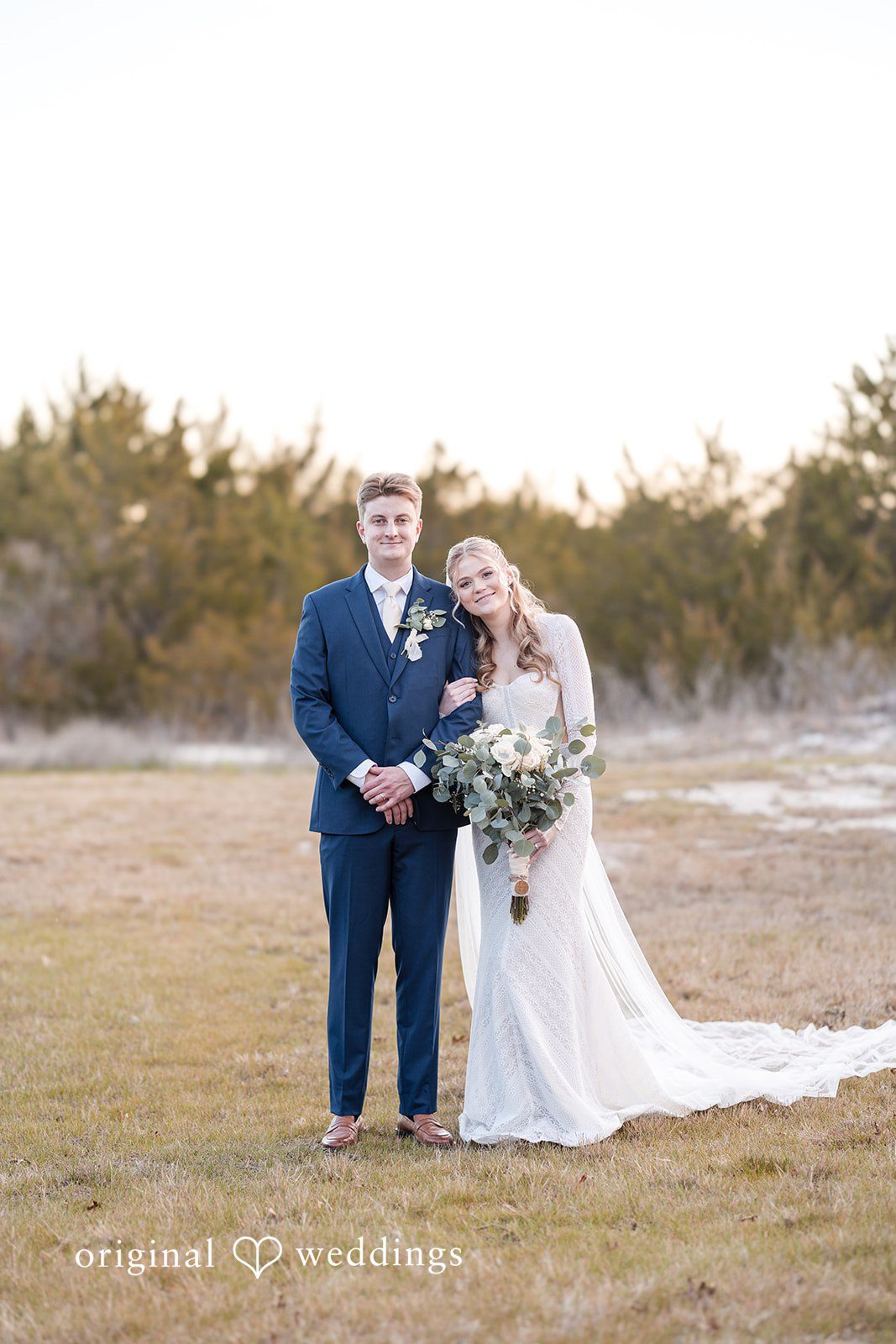 Jacobi + Marlie Romantic bride and groom posing together at Stone Crest