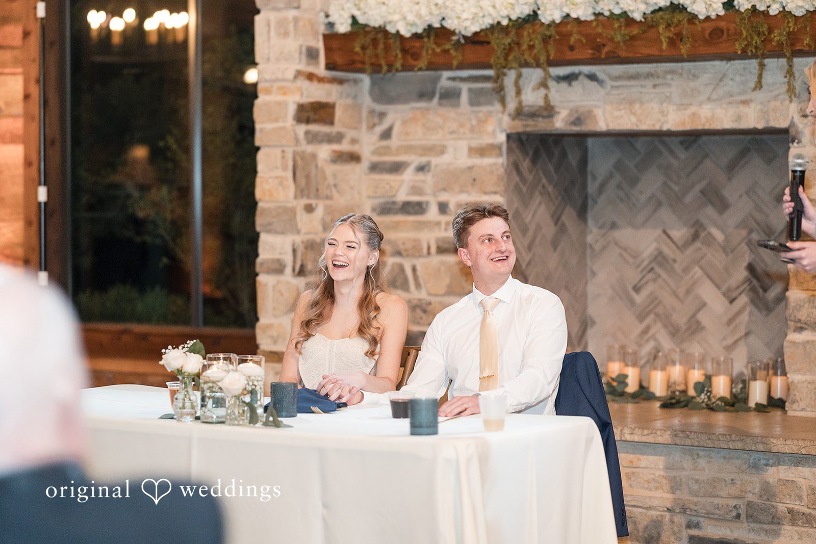 Jacobi + Marlie Dallas Wedding Photographers capturing couple seated together at reception table at Stone Crest by Original Weddings