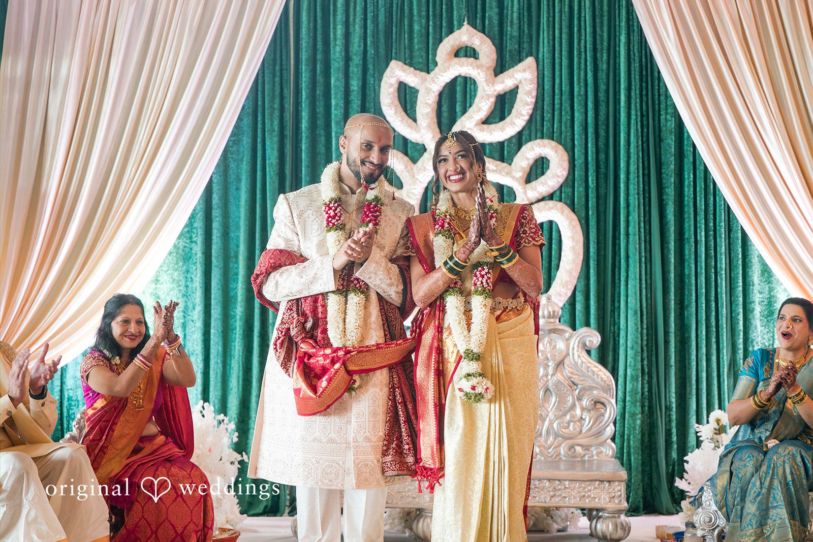 Bride and groom standing together on a stage at Stone Crest.