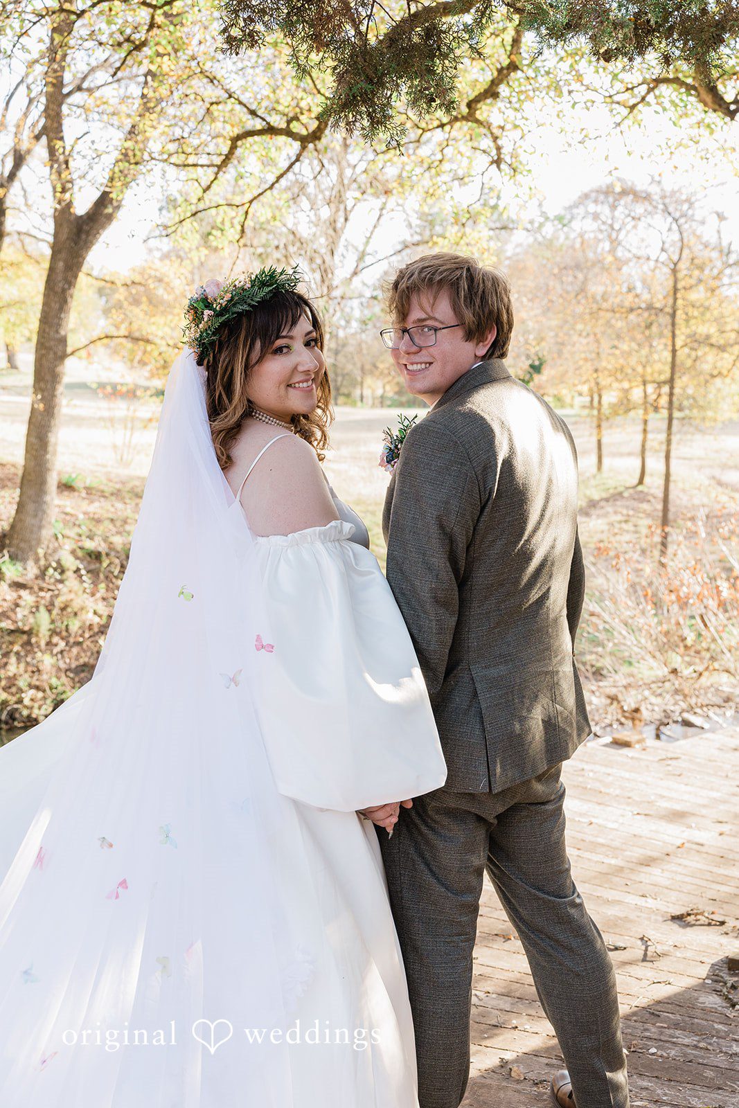 November 15, 2025 – Brittney & Benjamin- (ID-3986) A bride and groom walking together through a sunlit field.