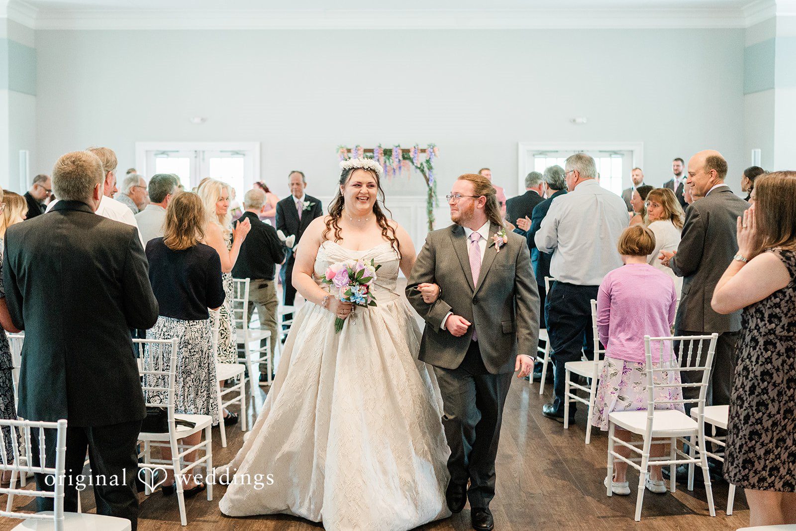 Beautiful couple leaving the altar after wedding ceremony at Sugar Valley Golf Club