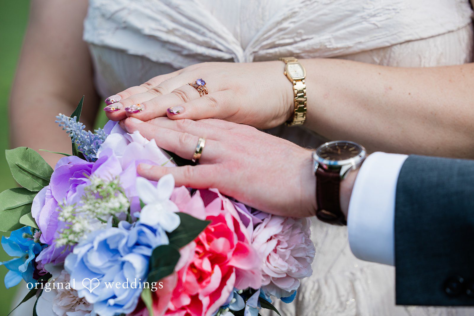 Beautiful shots of hands of bride and groom wearing wedding rings at Sugar Valley Golf Club