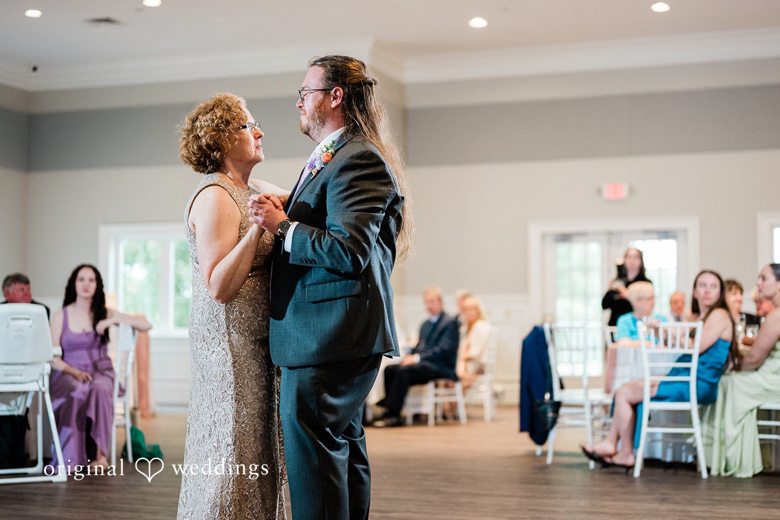 Groom sharing a dance with someone
