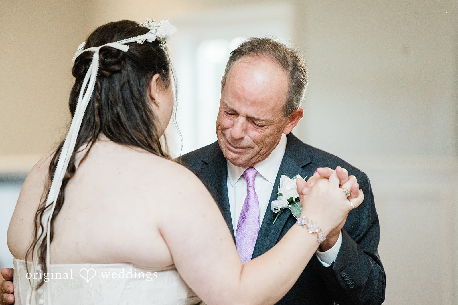 Bride sharing a dance with someone
