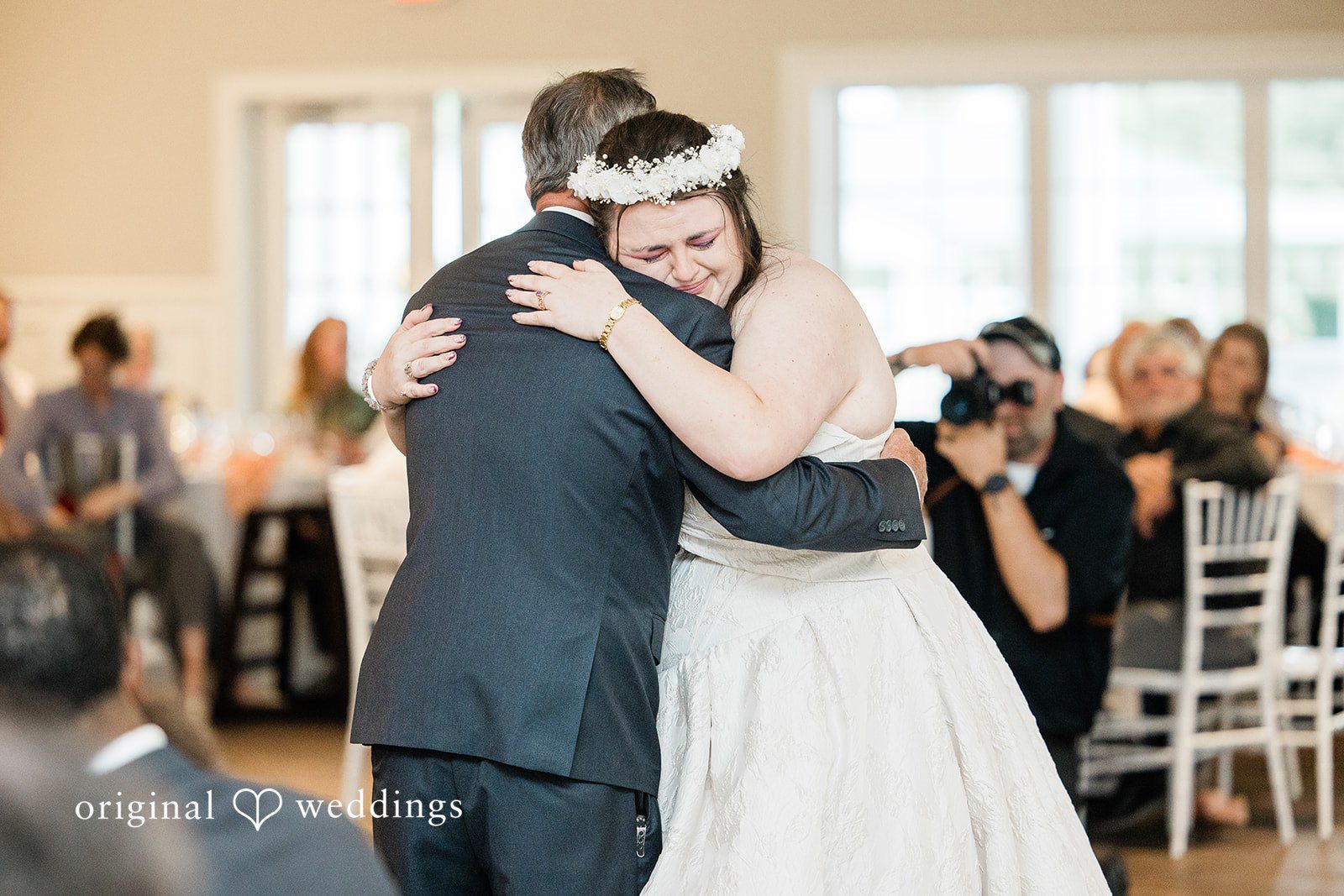 Bride sharing a emotional hug with someone