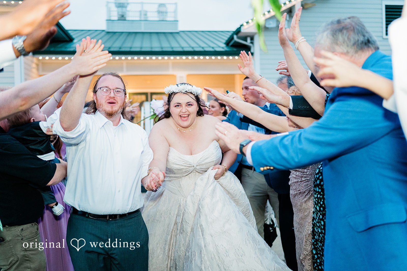 Beautiful couple walking through the guests at Sugar Valley Golf Club
