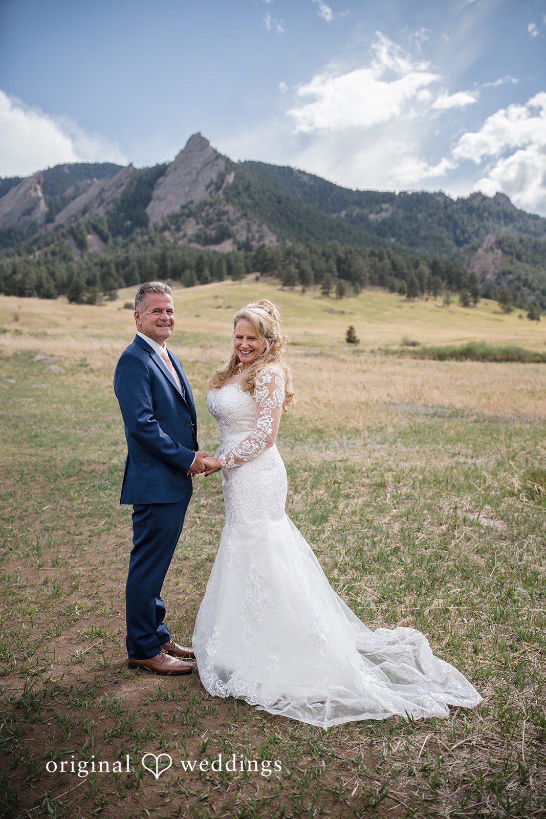 Jacquelyn + Millard Bride and groom portrait with the Flatirons backdrop