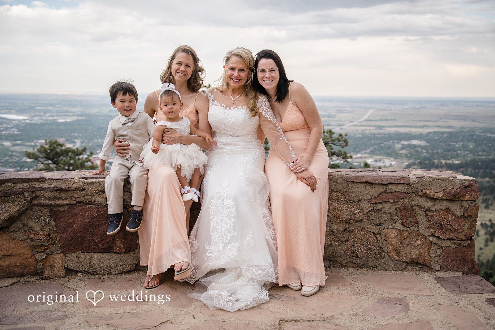 Jacquelyn + Millard Family portrait with the bride and loved ones overlooking the mountain view at Sunrise Amphitheater.