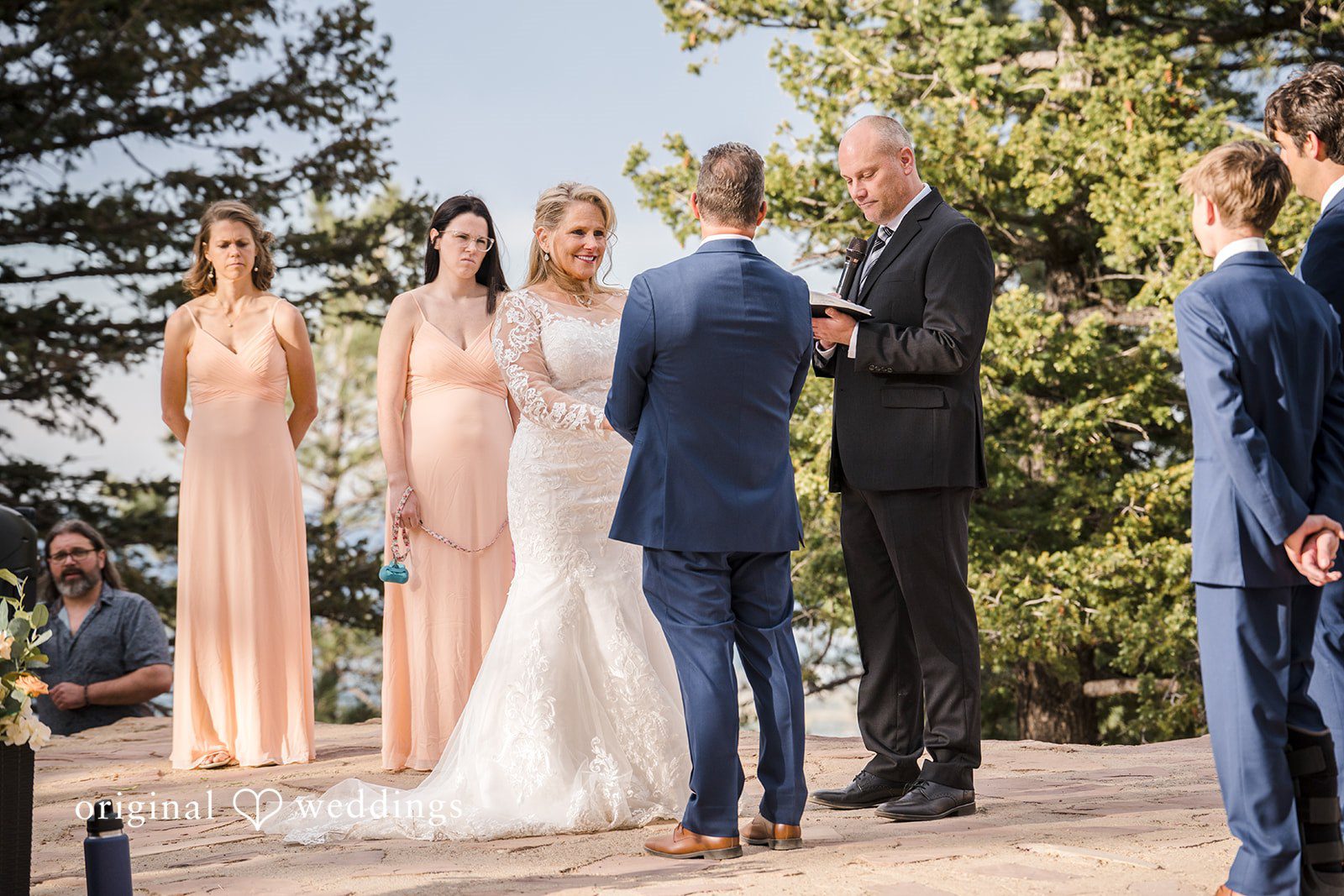Jacquelyn + Millard Bride and groom exchanging vows during their ceremony