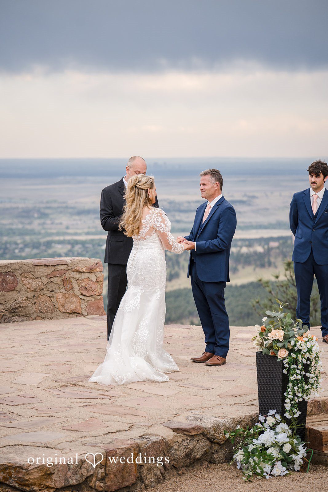 Jacquelyn + Millard Bride and groom exchanging vows during their ceremony