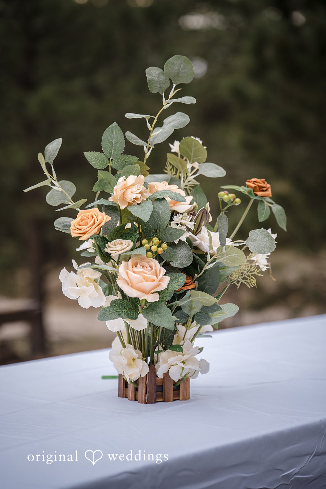 Jacquelyn + Millard Close-up of the elegant floral centerpiece on the ceremony table at Sunrise Amphitheater.